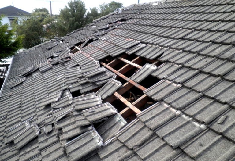 Roof with damage from a storm and needing replacing